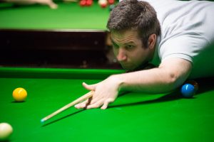 Peter Hull plays a snooker shot