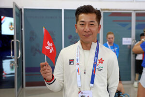 Andy Lam holding up the flag of Hong Kong China during the recent World Abilitysport Games in Thailand.