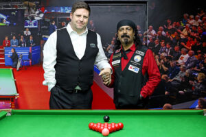 Daniel Kelly and Kal Mattu shake hands