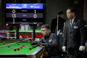 Andrew Blood plays a snooker shot