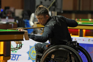 Andrew Blood plays a snooker shot