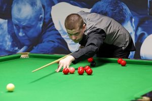 Buskin plays a snooker shot