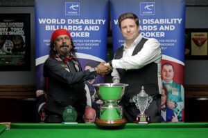 Kal Mattu and Daniel Kelly shake hands