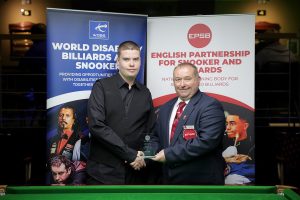Tournament Director Stuart Barker presents Archie Buskin with a silver medal at the English Disability Championship