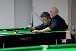 Andrew Blood plays a snooker shot