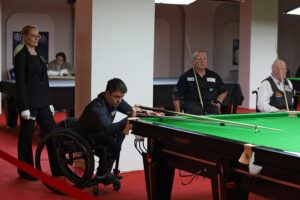 Andrew Blood plays a snooker shot