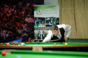 Daniel Kelly plays a snooker shot