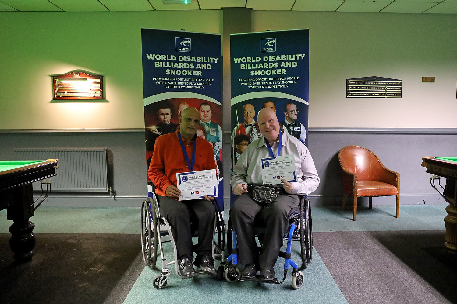 Aslam Abubaker and Gary Swith with medals smiling