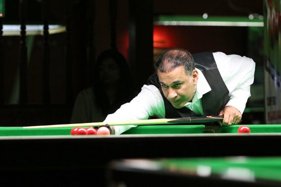 Shabir Ahmed plays snooker shot
