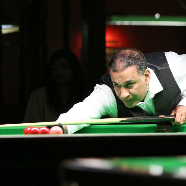 Shabir Ahmed plays snooker shot