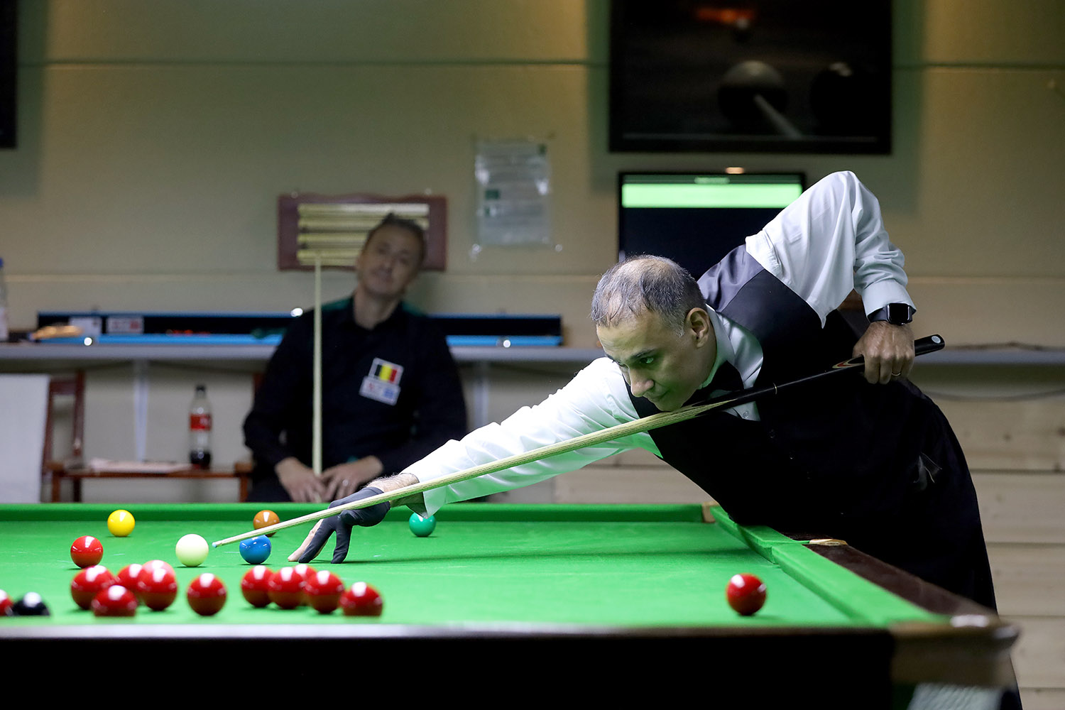 Shabir Ahmed plays snooker shot 