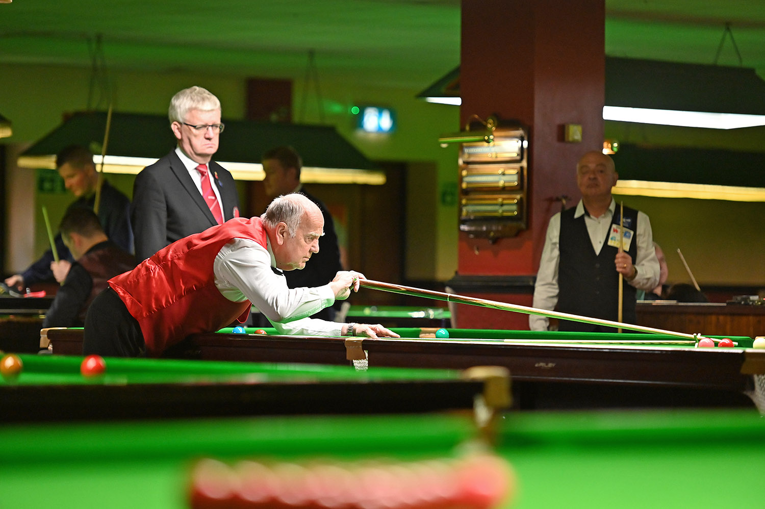 Ronnie Allen plays snooker shot with rest