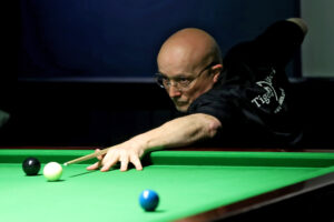 Dave Beaumont plays a snooker shot