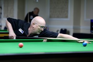 Dave Beaumont plays a snooker shot