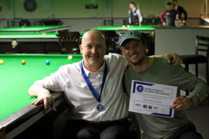 Dave Beaumont celebrates with his son after victory in Bruges