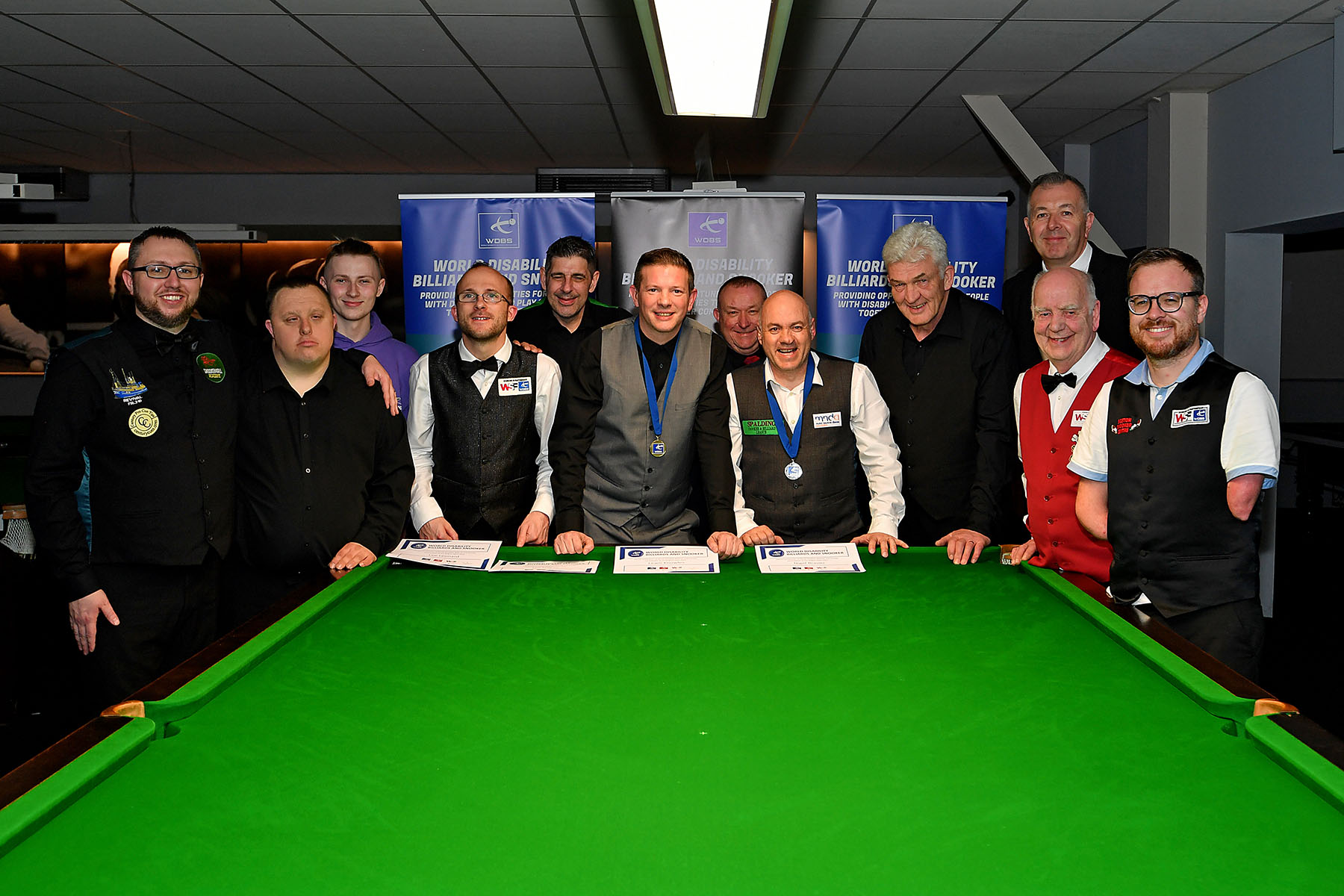 Group of snooker players smiling with medals