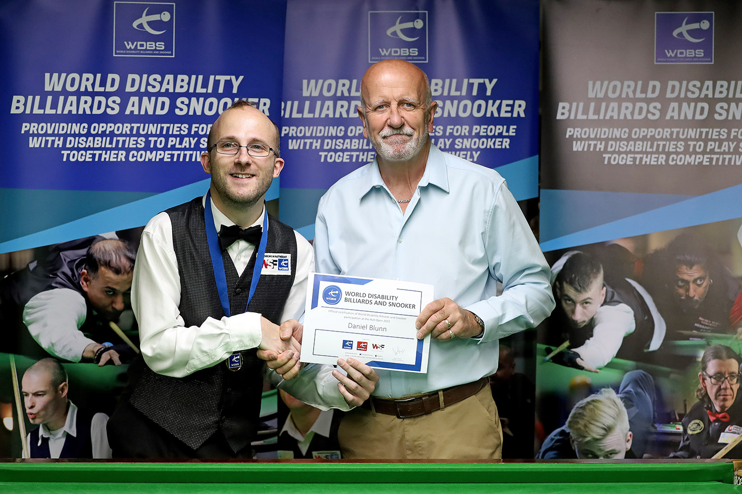 Daniel Blunn receives medal from Allan Wilson