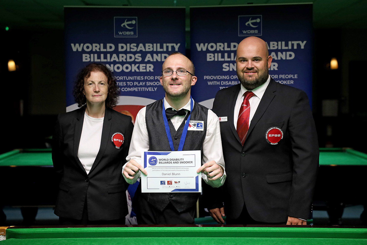 Daniel Blunn with officials Zoe Rodkoff and Josh Tunnicliffe