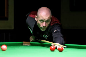 Dave Bolton plays a snooker shot