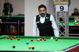 Shahzad Butt looks at the table