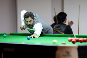 Shahzad Butt plays a snooker shot