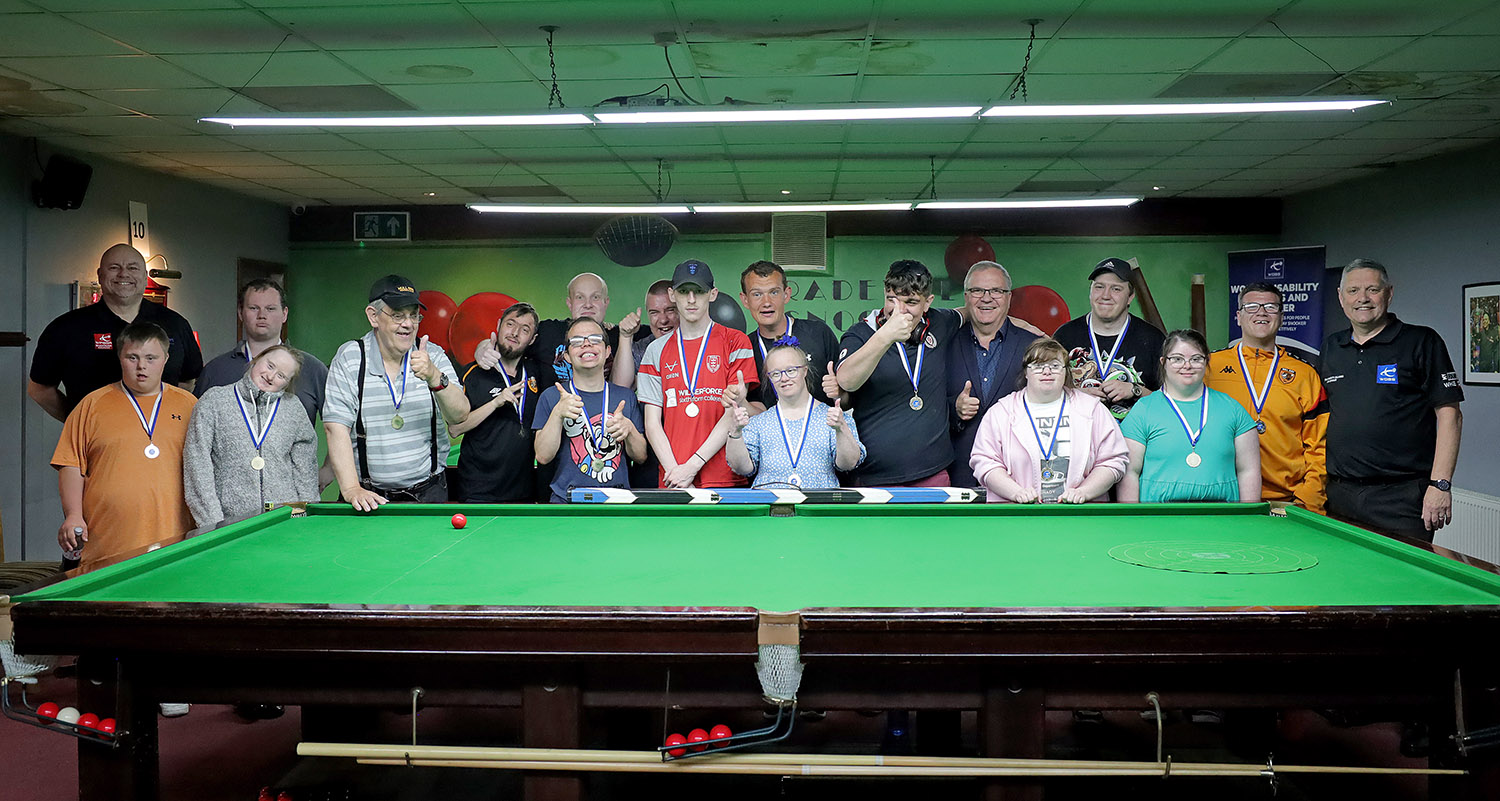 Group of people with thumbs up smiling