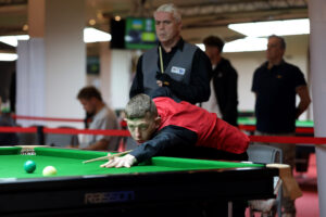 David Church plays a snooker shot