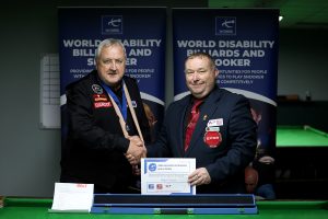 Nigel Coton receives his medal and certificate