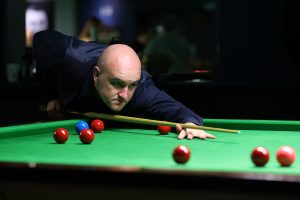 Dominic Crookes plays a snooker shot