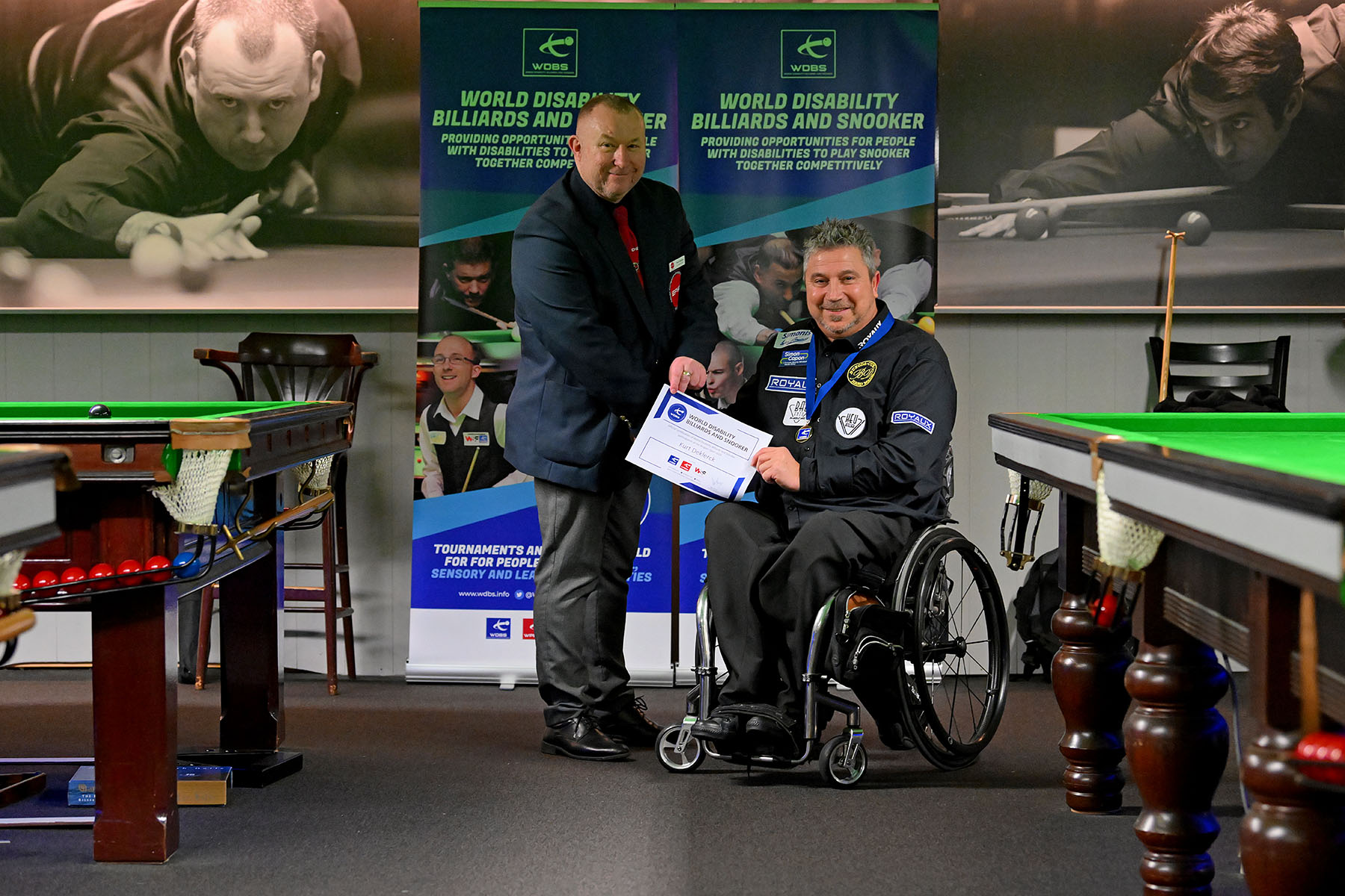 Kurt Deklerck receives medal and certificate from Stuart Barker