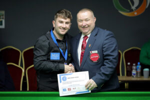 Luke Drennan receives his certificate from Stuart Barker