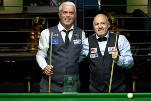 Carl Gibson and Nigel Brasier pose at the table before their final