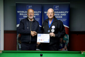 Mike Gillespie receives his medal and certificate