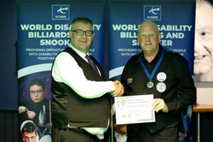 Mike Gillespie is awarded with his medal and certificate by Tournament Director James Chambers