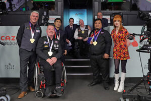 The gold medalists with Rob Walker and Abigail Davies on the Crucible stage