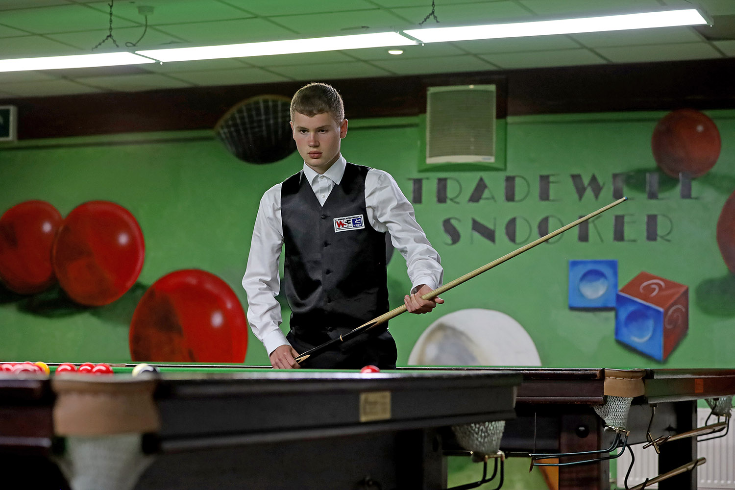 Matthew Haslam prepares to play snooker shot