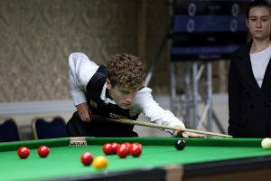 Matthew Haslam plays a snooker shot
