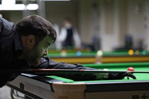 Nikolay Hristov plays a snooker shot