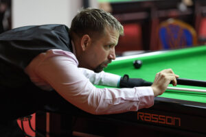 Peter Hull plays a snooker shot