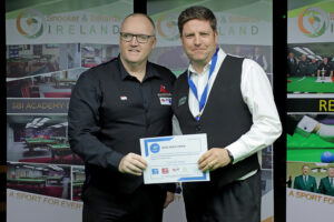 Daniel Kelly receives his certificate from Dylan Rees