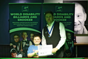 Daniel Kelly poses with his son after his victory