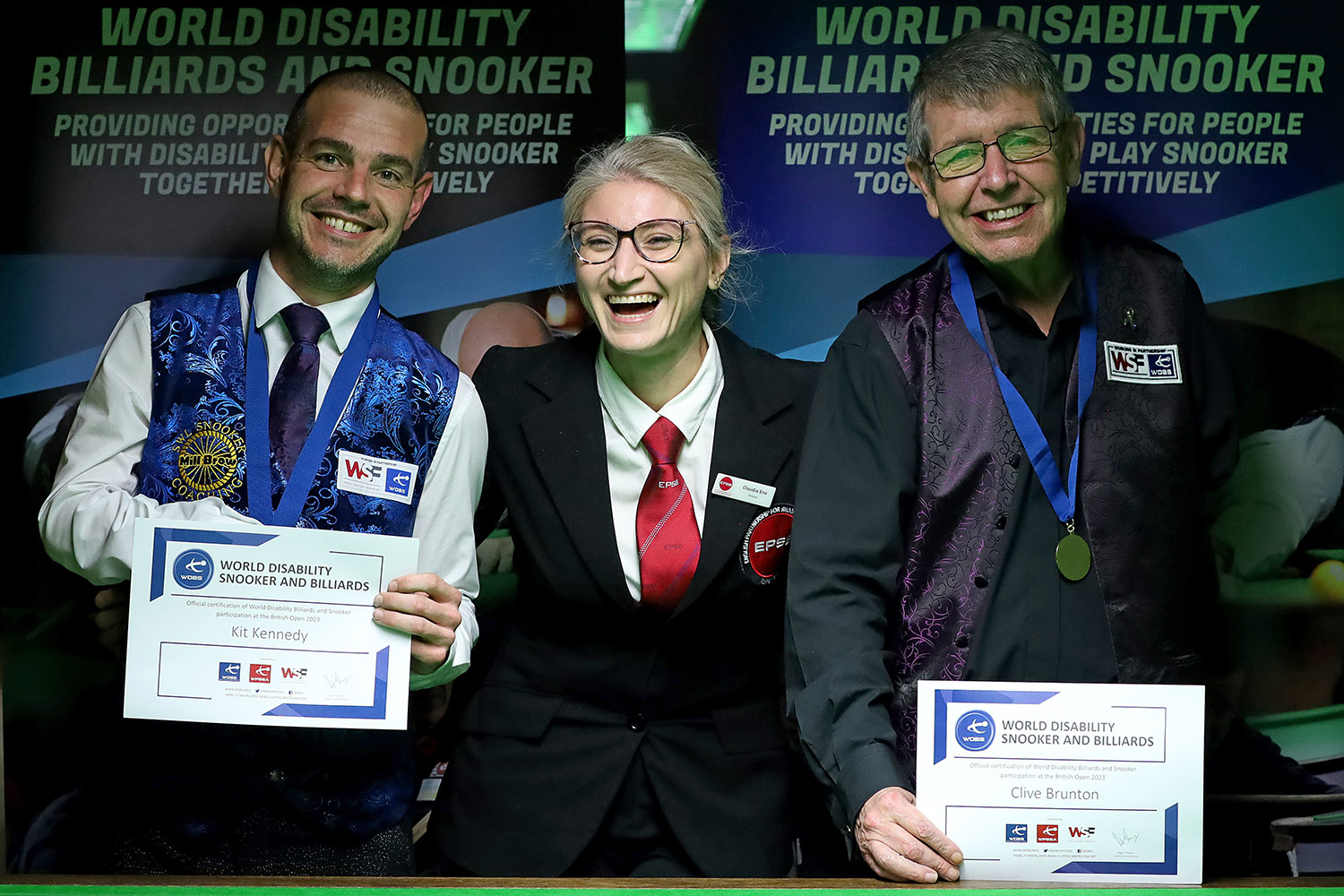 Three people smiling