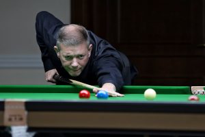 Lewis Knowles plays a snooker shot