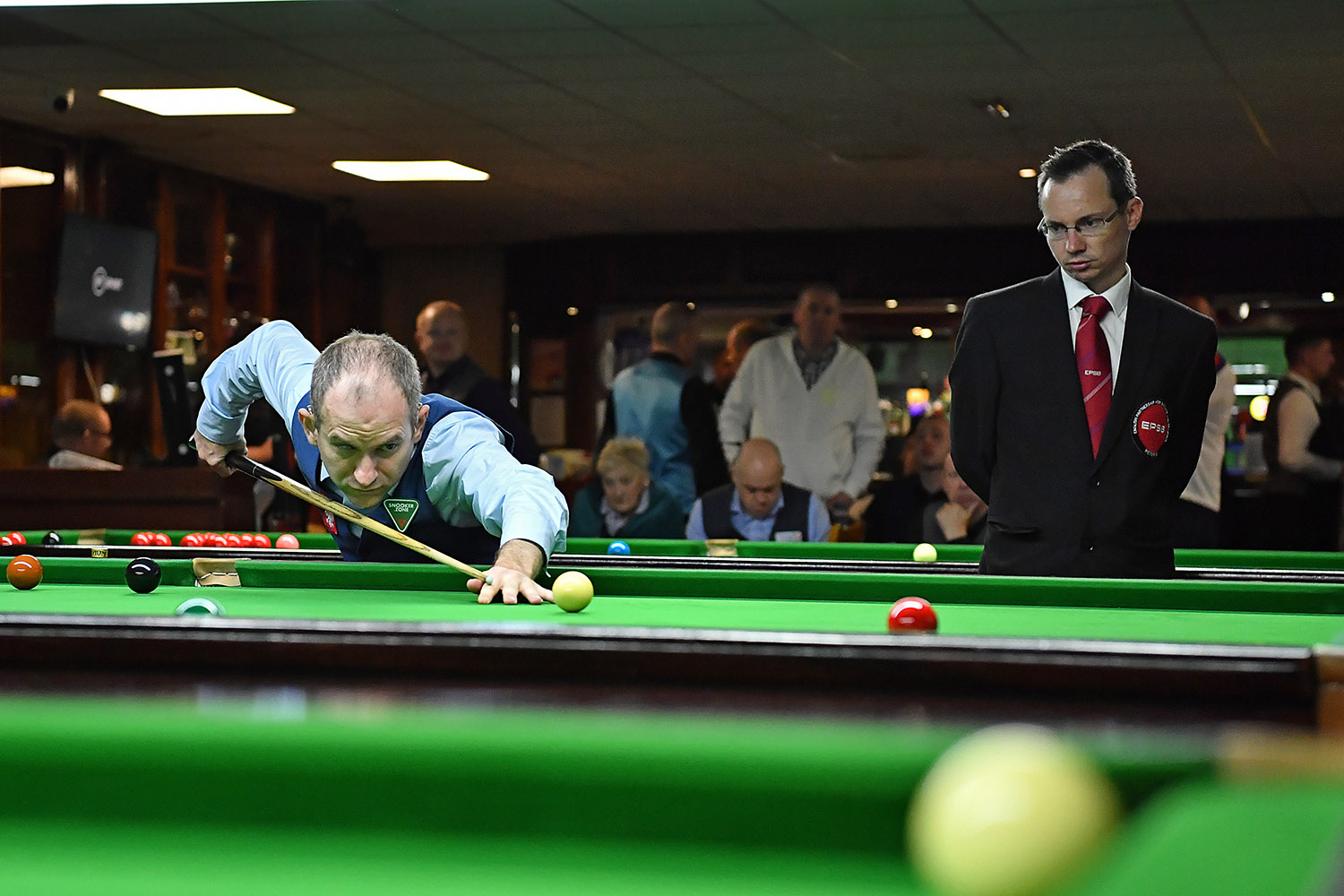 Snooker shot watched by referee