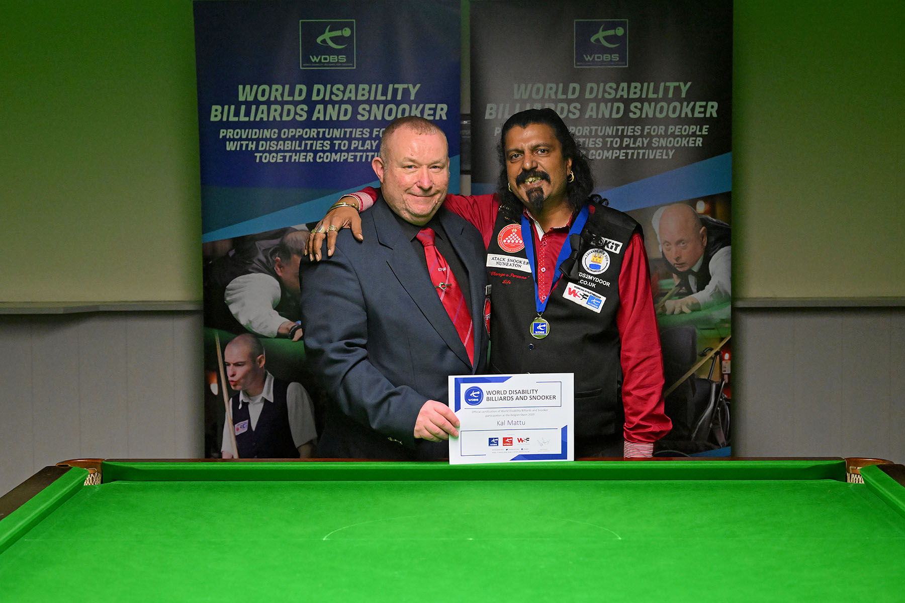 Stuart Barker and Kal Mattu with medal