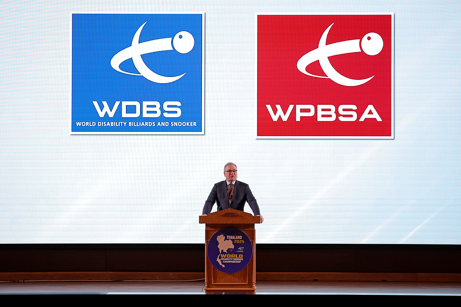 Nigel Mawer stood speaking with WPBSA and WDBS logos behind him