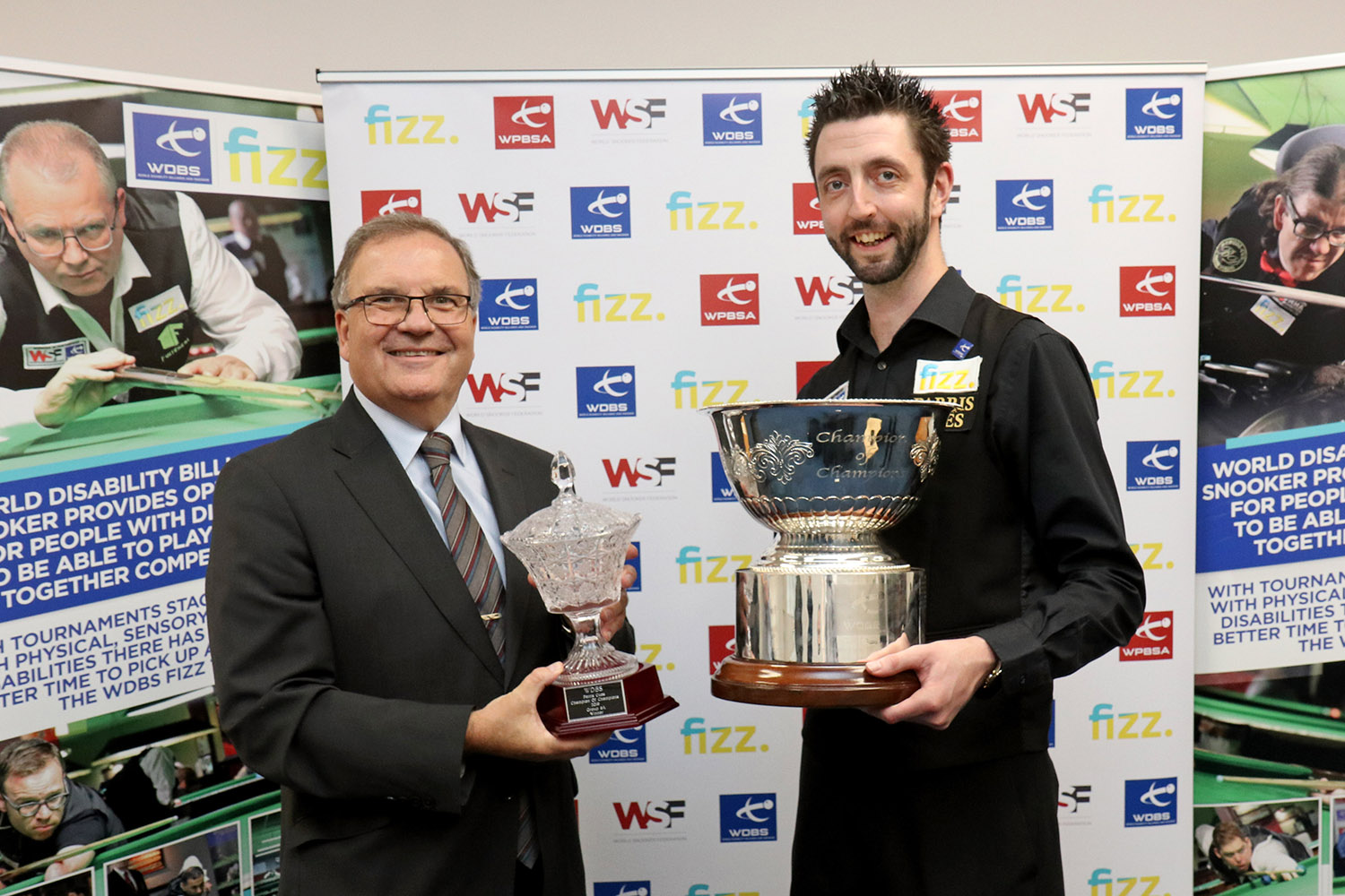 Nigel Mawer and Mike Busst hold trophy