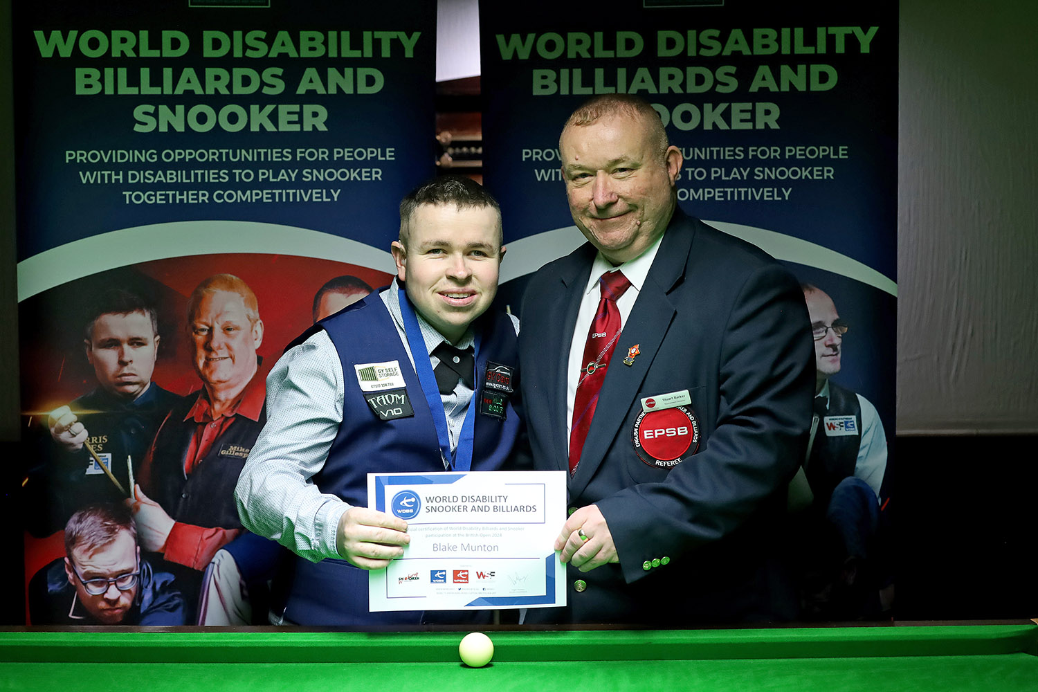 Blake Munton and Stuart Barker smile holding certificate