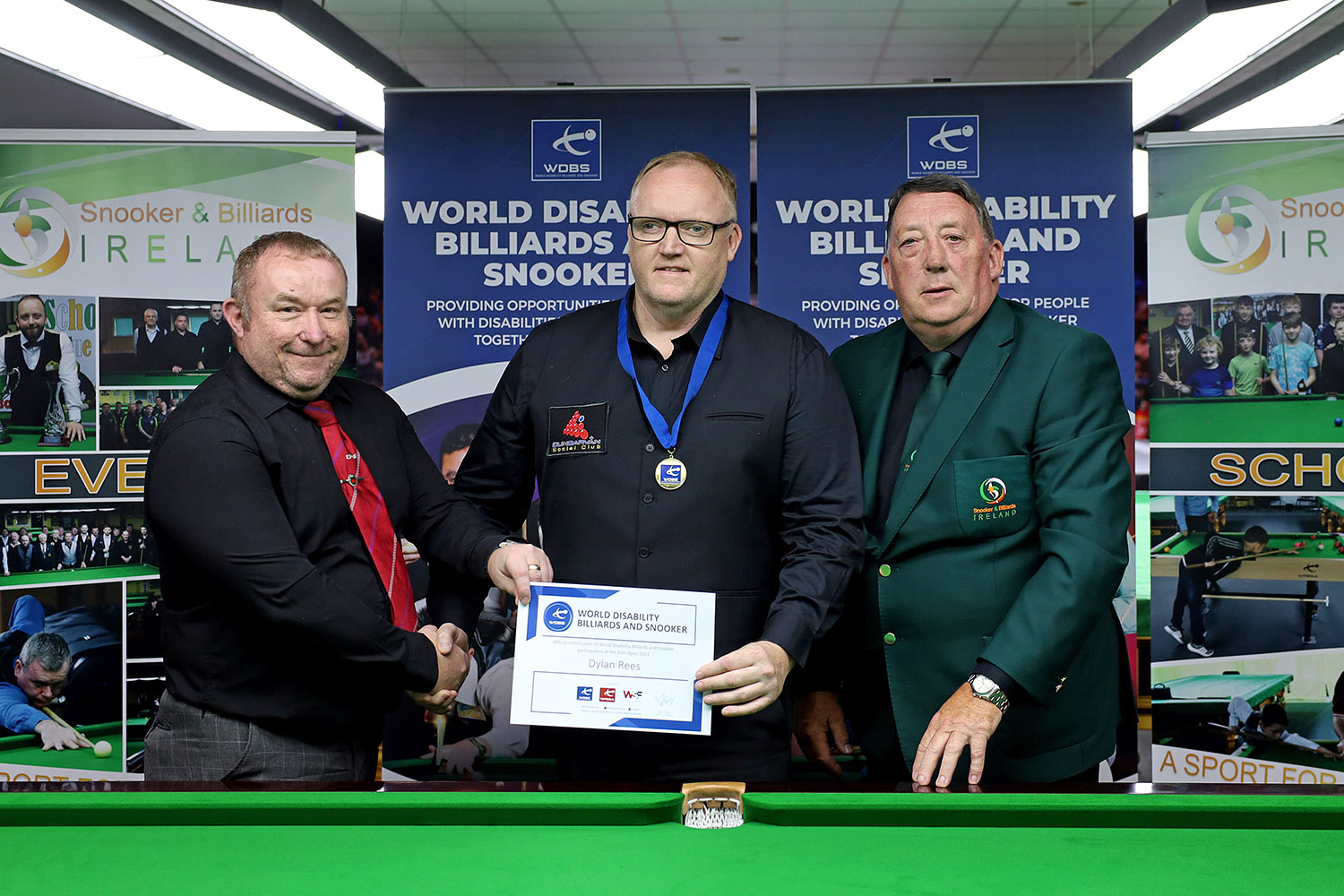 Dylan Rees with medal and certificate