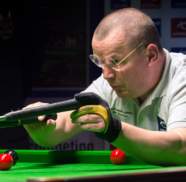 Tony Southern playing snooker shot using rest